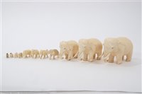 Lot 839 - Troop of seven antique carved ivory elephants,...