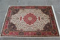 Lot 1393 - Kashan style carpet, central petalled...