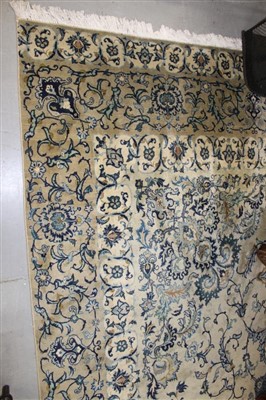 Lot 1672 - Fine Kashan carpet, cream ground with central...