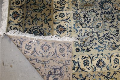 Lot 1385 - Fine Kashan carpet, cream ground with central...