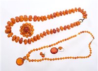 Lot 421 - Two amber necklaces, amber cluster brooch and...