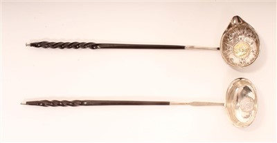 Lot 283 - Georgian silver toddy ladles with ornate...