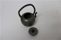 Lot 694 - 19th century Chinese pewter teapot of squat...