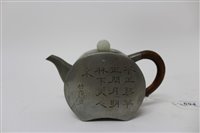 Lot 694 - 19th century Chinese pewter teapot of squat...