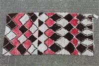 Lot 1388 - Moroccan rug, having lozenge ornament on cream...