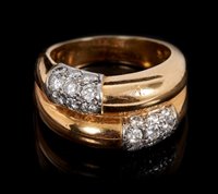 Lot 441 - Cartier diamond and gold crossover ring...