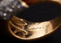 Lot 441 - Cartier diamond and gold crossover ring...