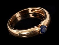 Lot 442 - Cartier 18ct gold and sapphire ring with a...