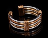 Lot 443 - Cartier two colour gold torque ring, the band...