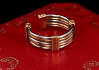 Lot 443 - Cartier two colour gold torque ring, the band...