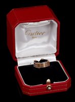 Lot 443 - Cartier two colour gold torque ring, the band...