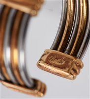 Lot 443 - Cartier two colour gold torque ring, the band...