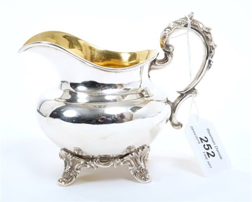 Lot 252 - Early Victorian silver cream jug of compressed...