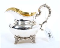 Lot 252 - Early Victorian silver cream jug of compressed...
