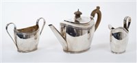 Lot 220 - 1930s silver three piece tea set of oval form,...