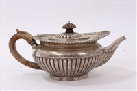 Lot 197 - Regency-style silver teapot of squat ribbed...