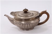 Lot 197 - Regency-style silver teapot of squat ribbed...