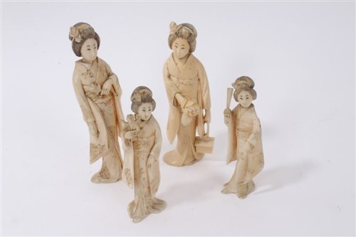 Lot 704 - Pair of Japanese Meiji period carved ivory...