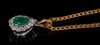 Lot 482 - Emerald and diamond pendant, the pear cut...