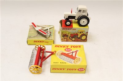 Lot 2744 - Dinky David Brown Tractor no. 305, Dm Harrow no. 332, Hay Rake no. 324, all boxed (3)