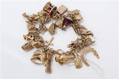 Lot 3240 - Gold (9ct) charm bracelet with quantity of gold novelty charms