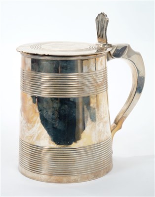 Lot 438 - George III silver lidded tankard of tapering cylindrical form, with bands of reeded decoration, scroll handle and flat hinged cover with pierced thumb piece (London 1804)