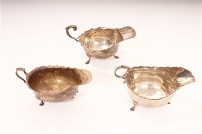 Lot 442 - Three early 20th century silver sauce boats of conventional form, on hoof feet (various dates and makers).  All at approximately 12ozs