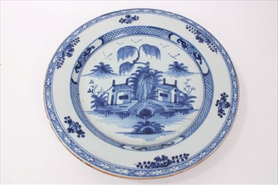 Lot 61 - Mid-18th century Lambeth Delft blue and white charger with Chinese landscape decoration, 34.5cm