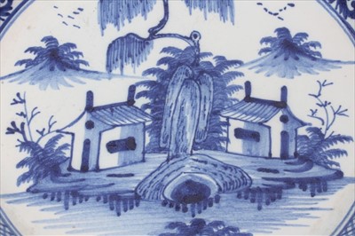 Lot 61 - Mid-18th century Lambeth Delft blue and white charger with Chinese landscape decoration, 34.5cm