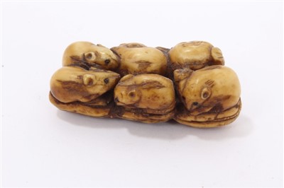 Lot 966 - Meiji period Japanese ivory netsuke in the form of a puppy