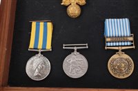 Lot 511 - Korean War Medal Pair mounted in glazed case