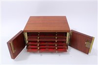 Lot 119 - Coin cabinet – a fine teak coin cabinet containing eight coin trays (N.B. with key) (1 item)