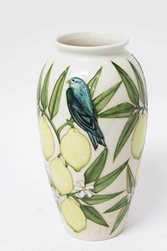 Lot 2040 - Contemporary Moorcroft Pottery vase decorated with bird and lemons on cream ground