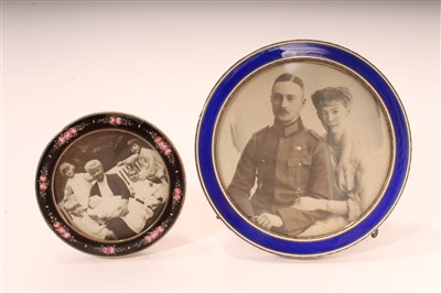 Lot 481 - Continental silver photograph frame of circular form, together with one other smaller