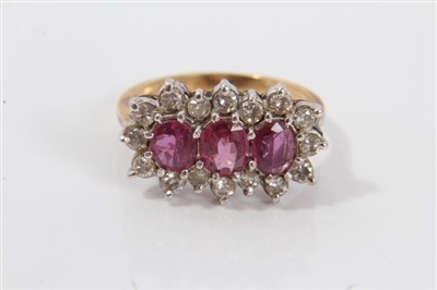 Lot 3301 - Gold (18ct) ruby and diamond cluster ring with...