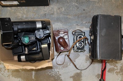 Lot 3794 - Two vintage Rolleiflex TLR cameras, one a 3.5F with Zeiss
Planar lens and case, the other a 3.5T with Zeiss Tessar lens, together with
five Metz flashguns and a Polaroid Passport camera