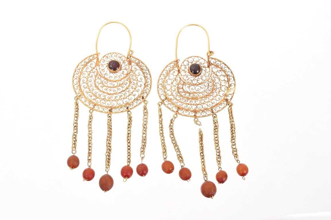 Lot 716 - Large pair of antique Indian gold filigree earrings with old amber beads drops