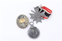 Lot 528 - Nazi War Merit Cross (with swords) together with a Nazi Medal for the winter campaign in Russia 1941 - 42 and a Nazi wound Badge (De-nazified)