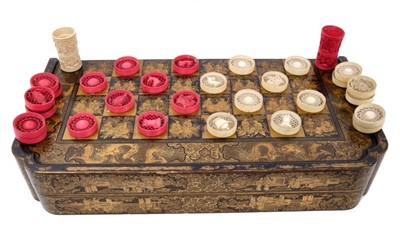 Lot 917 - Early 19th century Cantonese carved and stained ivory chess/backgammon set in lacquered box