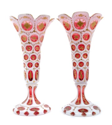 Lot 253 - Pair of mid-19th century Bohemian ruby and white overlaid glass vases, splayed foot, 27.5cm