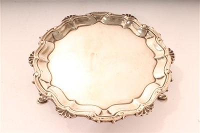 Lot 354 - George II silver card tray, of circular form, London 1756