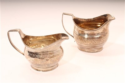 Lot 358 - Two George III silver helmet shaped cream jugs, 1802 / 1810