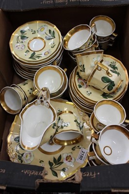 Lot 2180 - Porcelain tea and coffee service with gilt rim and floral
decoration on yellow ground (43 pieces)