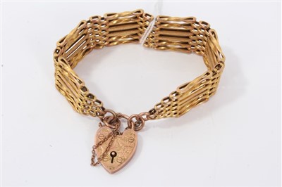 Lot 3231 - Rose gold (9ct) gate bracelet with padlock clasp