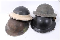 Lot 600 - Group of four Second World War British Military MKII Steel Helmets to include Home Front Ambulance Driver and Camouflaged Helmet dated 1939 (4)