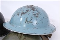 Lot 601 - Group of four Second World War British Military MKII Steel Helmets to include Home Front / Civil Defence and Camouflaged Helmet dated 1939 (4)
