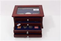 Lot 121 - G.B. Three Decades of King George V – silver coins and postage stamps – to include Crown 1935 and others in four-drawer glass-topped teak cabinet (1 item)
