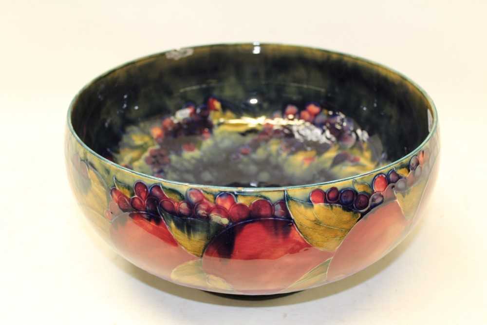 Lot 2001 - Large Moorcroft pottery bowl decorated in the Pomegranate pattern, impressed marks and green painted signature to base, 30cm diameter