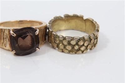 Lot 3246 - Group five 1970s yellow metal textured design rings, two set with gem stones