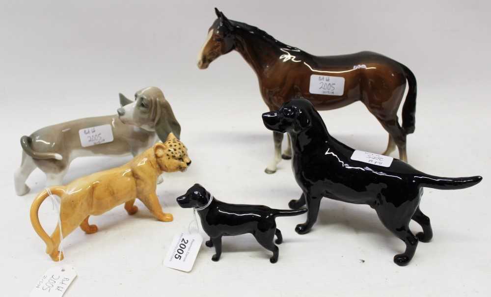 Lot 2005 - Two Beswick black Labradors, Beswick horse, wild cat and a Lladro sausage dog (5)